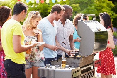 people grilling in their backyard