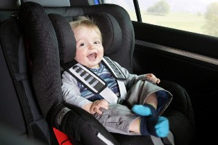 road trip safety tips child buckled