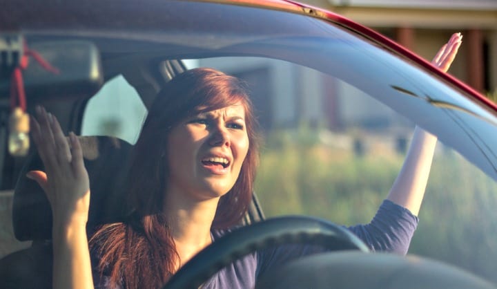 Woman experiencing road rage.