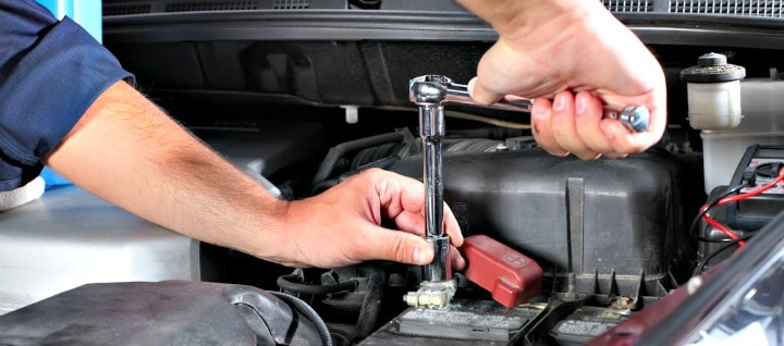 Man working on car.