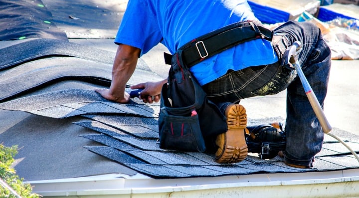 man fixing roof