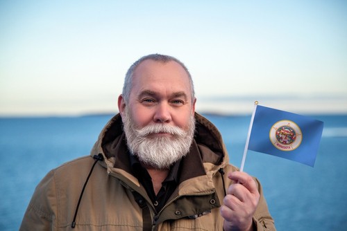 Minnesota driver holding state flag